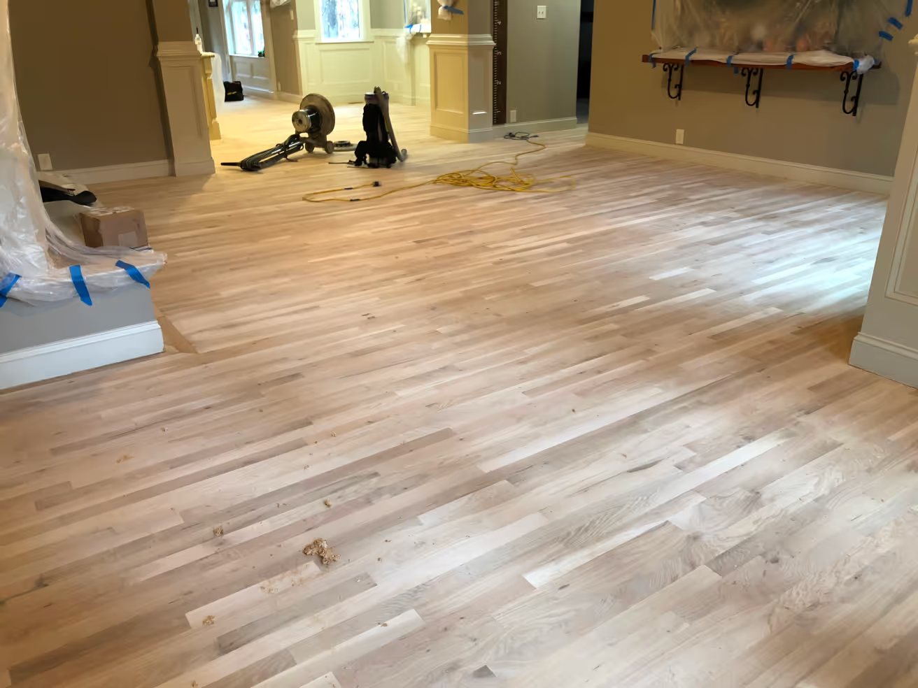 New red oak hardwood replacing carpet, freshly finished