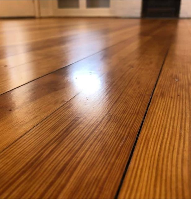 Freshly refinished hardwood with a satin sheen