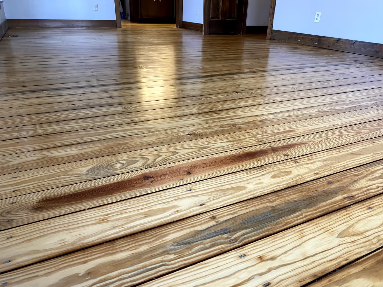 Mid-refinish contrast between stained and unstained boards