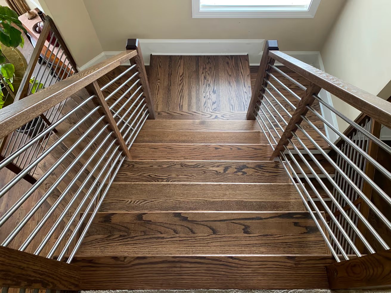 Split staircase with hardwood landing